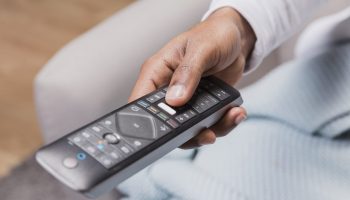 close-up-man-holding-remote